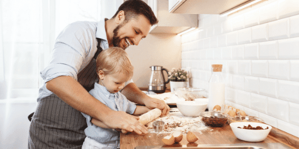 Dad teaching son to cook