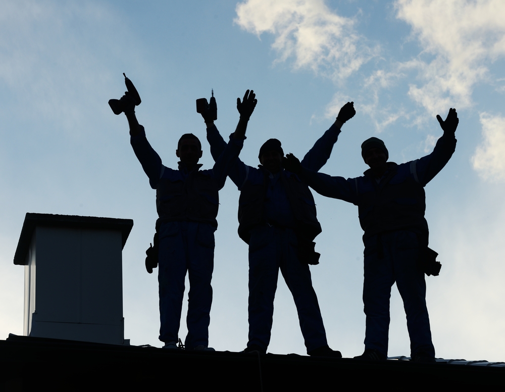Building roof construction site teamwork silhouette